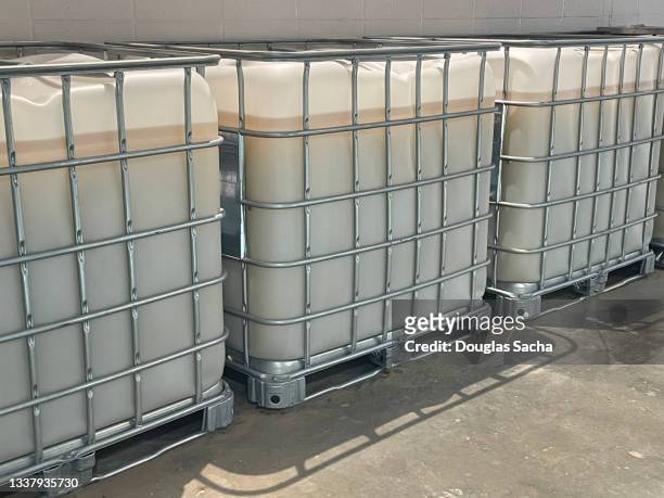 bulk chemical storage containers on a industrial pallet - water tower storage tank stock pictures, royalty-free photos & images