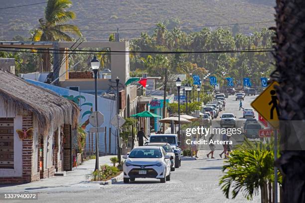Tourists in the main street of the coastal village Todos Santos on the peninsula of Baja California Sur, Mexico.