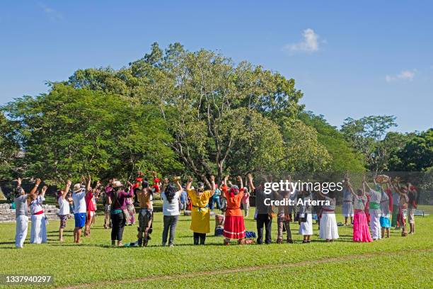 Tourists and Mexicans in traditional Maya outfits celebrating spring equinox at the pre-Columbian Maya civilization site of Palenque, Chiapas, Mexico.