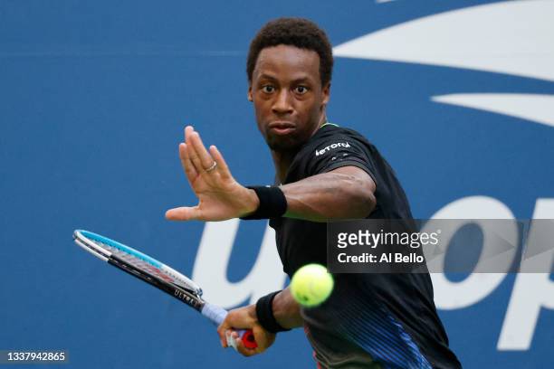 Gael Monfils of France returns the ball against Steve Johnson of United States during during his Men's Singles second round match on Day Four of the...