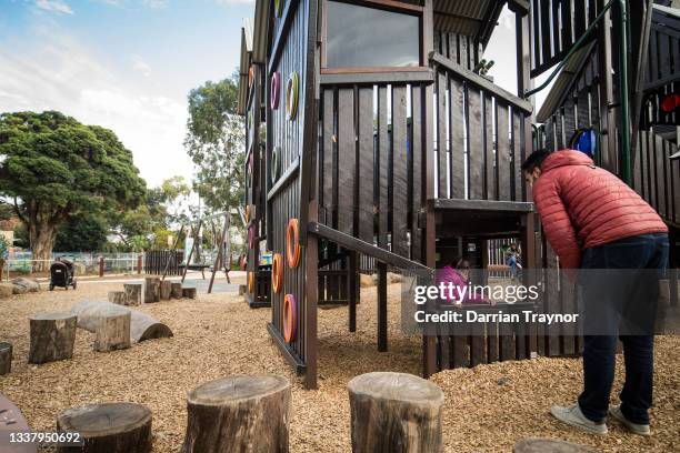 Parent and children enjoy time at a playground in Brunswick on September 03, 2021 in Melbourne, Australia. Victoria has recorded 208 new COVID-19...