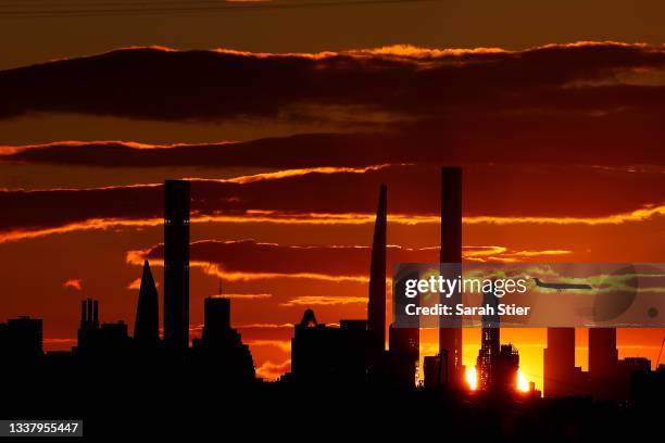 View of the New York City skyline is seen as the sun sets from Arthur Ashe Stadium on Day Four of the 2021 US Open at USTA Billie Jean King National...