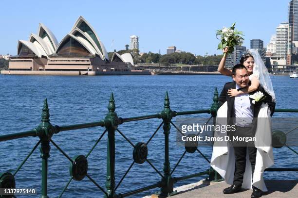 Daniel and Ella Kim pose for photos after their wedding held at Olympic Park in the suburb of Milsons Point on September 03, 2021 in Sydney,...