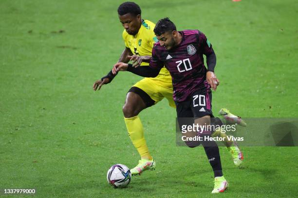 Alexis Vega of Mexico battles for possesion with Alvas Powell of Jamaica during the match between Mexico and Jamaica as part of the Concacaf 2022...