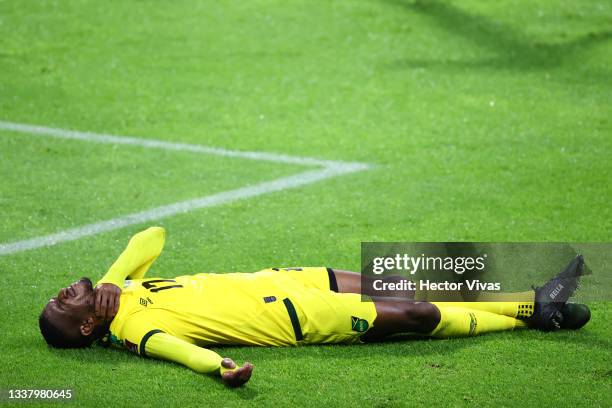 Damion Lowe of Jamaica reacts after being hit during the match between Mexico and Jamaica as part of the Concacaf 2022 FIFA World Cup Qualifier at...