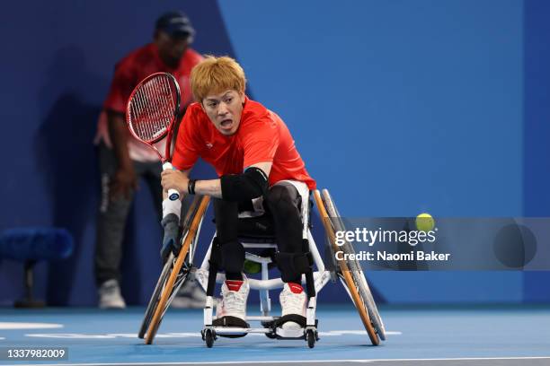 Koji Sugeno of Team Japan plays a backhand against Niels Vink of Team Netherlands during the Wheelchair Tennis Quad Singles Bronze Medal match on day...
