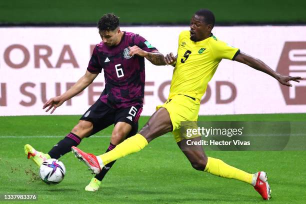 Jorge Sanchez of Mexico battles for possesion with Cory Burke of Jamaica during the match between Mexico and Jamaica as part of the Concacaf 2022...