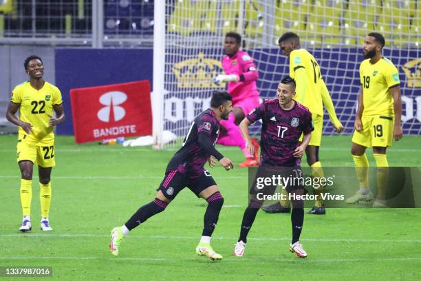 Alexis Vega of Mexico celebrates with teammates after scoring the first goal of his team during the match between Mexico and Jamaica as part of the...