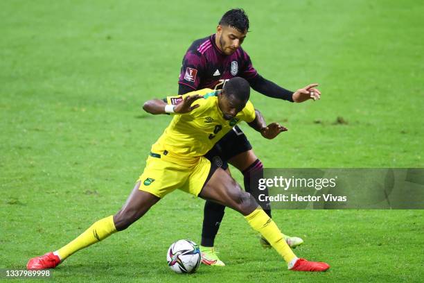 Alexis Vega of Mexico battles for possesion with Cory Burke of Jamaica during the match between Mexico and Jamaica as part of the Concacaf 2022 FIFA...
