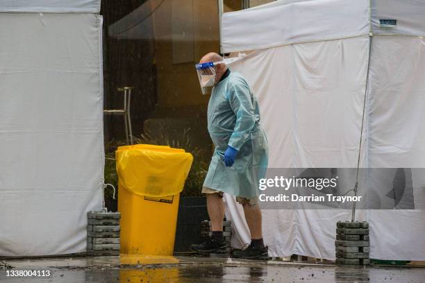 Man wearing PPE is seen outside the Quality Hotel Carlton on September 03, 2021 in Melbourne, Australia. The Hotel has been listed as a tier 1...