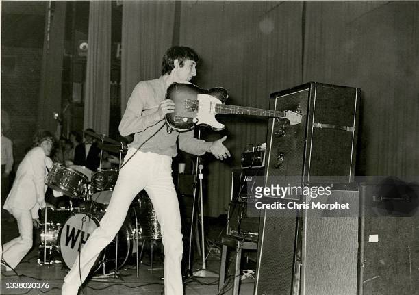 Pete Townshend of The Who smashes a Fender Telecaster guitar into the speaker cab of his amplifier during a concert at the Oberrheinhalle, Offenburg,...