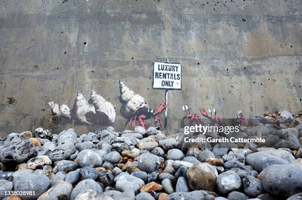 Artwork by Banksy is seen on Cromer East beach on August 22, 2021 in Cromer, England. The artwork is part of a series titled 'A Great British...