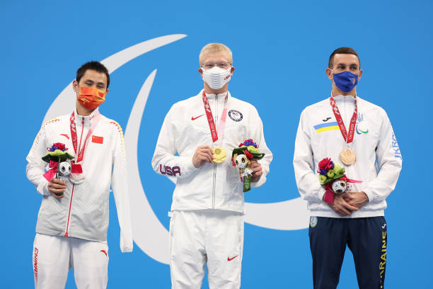 Silver medalist Feng Yang of Team China, gold medalist Robert Griswold of Team United States and bronze medalist Denys Dubrov of Team Ukraine pose on...