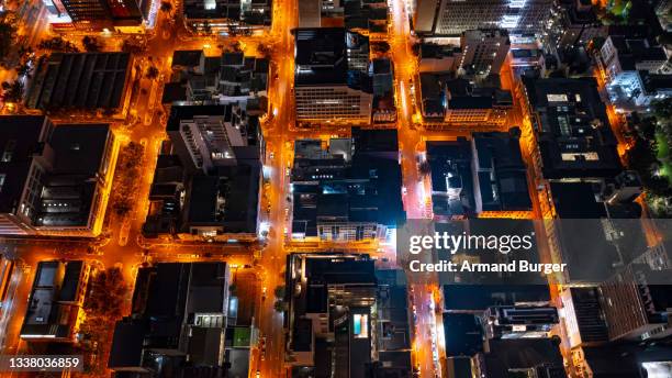 high angle shot of cape town city at night - south africa aerial stock pictures, royalty-free photos & images