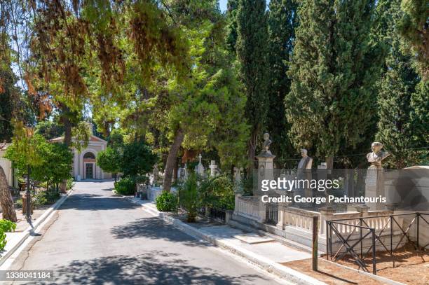 street with tombs in the first cemetery of athens, greece - evergreen cemetery stock pictures, royalty-free photos & images