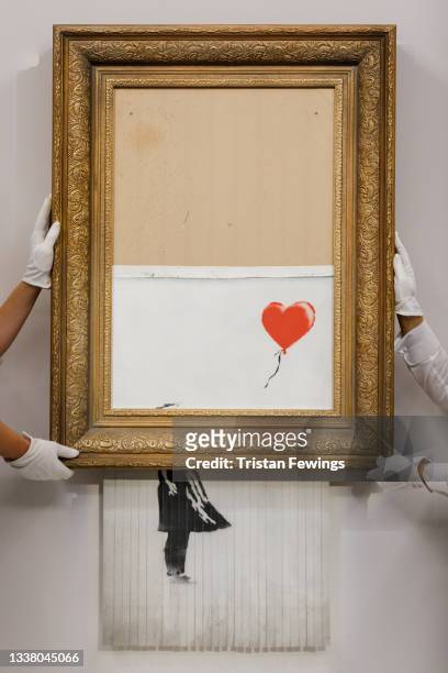 Banksy's Love is in the Bin is installed at Sotheby's on September 03, 2021 in London, England. Banksy's Love is in the Bin will go on public view...