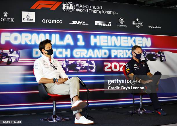 Red Bull Racing Team Principal Christian Horner and Mercedes GP Executive Director Toto Wolff talk in the Team Principals Press Conference during...