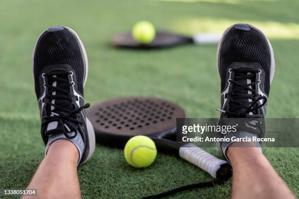 paddle tennis rackets and ball on turf - pudel stock pictures, royalty-free photos & images