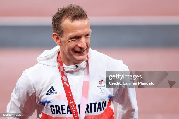 Richard Whitehead of Team Great Britain celebrates with the silver medal during the medal ceremony for the Men's 200m - T61 on day 10 of the Tokyo...