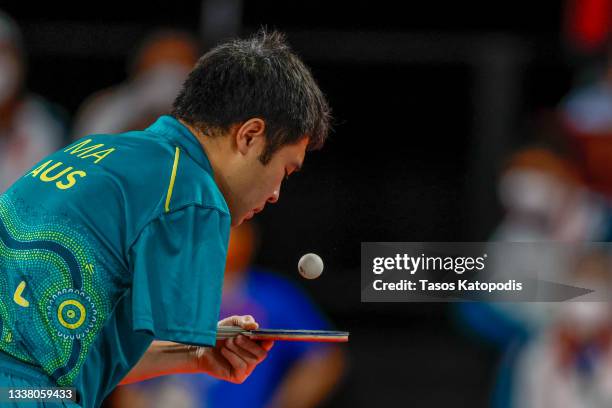 Lin Ma of Team Australia competes with Lian Hao of Team Peoples Republic of China in the men's table tennis team classes 9-10 gold match on day 10 of...