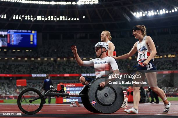 Nathan McGuire, Jonnie Peacock and Libby Clegg of Team Great Britain celebrate after winning silver in the 4x100m Universal Relay on day 10 of the...