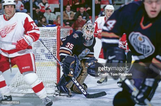 Tommy Salo of Sweden and Goalktender for the Edmonton Oilers looks on while tending goal during the NHL Eastern Conference Central Division game...