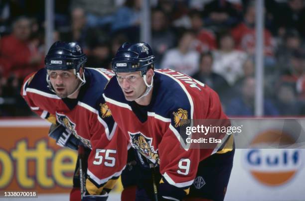 Kirk Muller of Canada and Left Wing for the Florida Panthers look on with compatriot and Defenseman team mate Ed Jovanovski during the NHL Eastern...