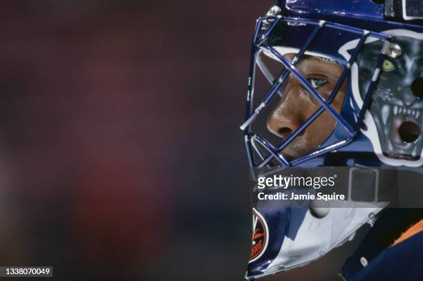 Kevin Weekes of Canada and Goaltender for the New York Islanders looks on from behind his mask while tending goal during the NHL Eastern Conference...