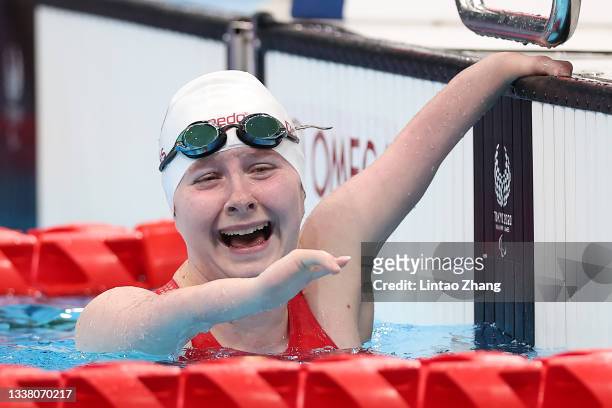 Danielle Dorris of Team Canada celebrates winning the gold medal after competing in the Women's 50m Butterfly - S7 Final on day 10 of the Tokyo 2020...