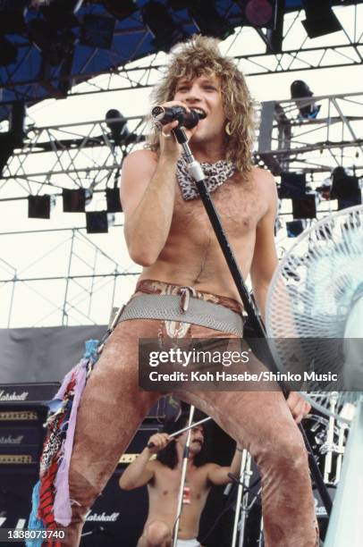 Jon Bon Jovi of US rock band Bon Jovi performs at summer rock festival 'Super Rock 84' on their first visit to Japan, Naogoya Baseball Stadium,...