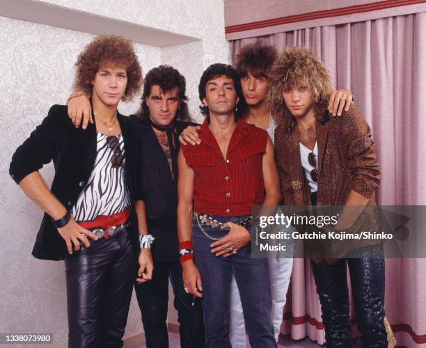 Rock band Bon Jovi, group portrait in a hotel room during their first visit to Japan, Nagoya Kanko Hotel, Aichi, Japan, 4th August 1984. David Bryan,...