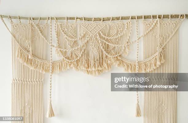 handmade macrame wedding arch on white wall cotton weaving boho style - macrame stock pictures, royalty-free photos & images