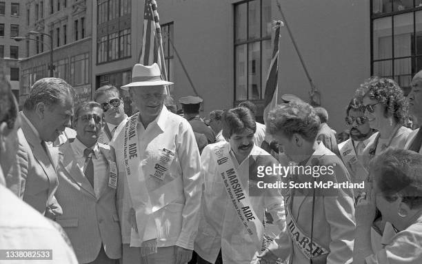 View of Mayor Ed Koch with the Grand Marshal and her aides at the Puerto Rican Day parade on 5th Avenue, New York, New York, June 12, 1988.