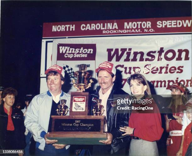 Dale Earnhardt , car owner Richard Childress and wife Teresa Earnhardt celebrate clinching the 1987 Winston Cup Championship following the AC Delco...