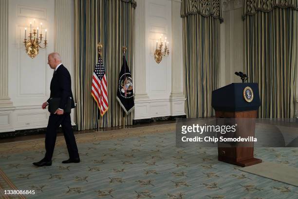 President Joe Biden walks away from the lectern after delivering remarks on the August jobs numbers in the State Dining Room at the White House on...