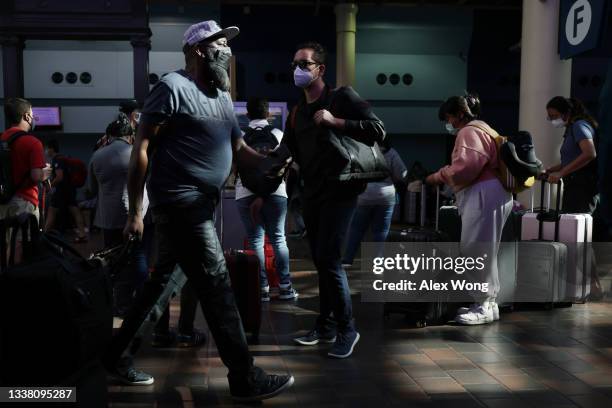Passengers pass through the concourse of Union Station September 3, 2021 in Washington, DC. The director of the Centers for Disease Control and...