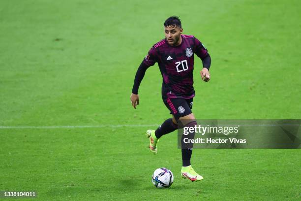 Alexis Vega of Mexico drives the ball during the match between Mexico and Jamaica as part of the Concacaf 2022 FIFA World Cup Qualifier at Azteca...