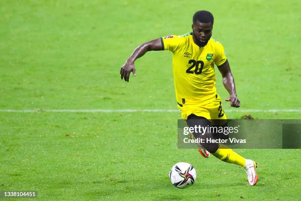 Michael Lawrence of Jamaica drives the ball during the match between Mexico and Jamaica as part of the Concacaf 2022 FIFA World Cup Qualifier at...