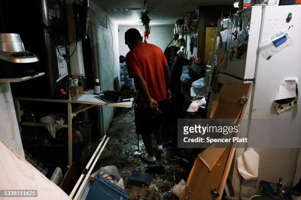 Eddie, an immigrant from Mexico, walks through his flooded basement level apartment in a Queens neighborhood that saw massive flooding and numerous...