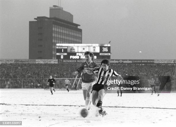 Newcastle United striker Peter Beardsley gets in a shot at goal despite the attentions of Foxes defender Russell Osman and the snow covered pitch...