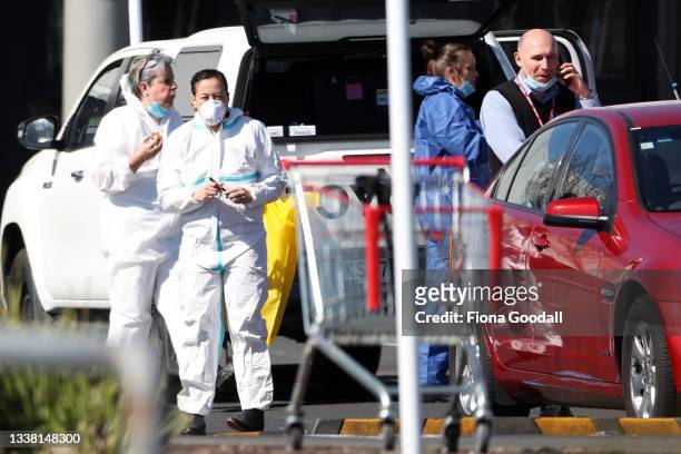 Police forensic staff prepare and head into Countdown Lynmall on September 04, 2021 in Auckland, New Zealand. Police shot and killed a "violent...