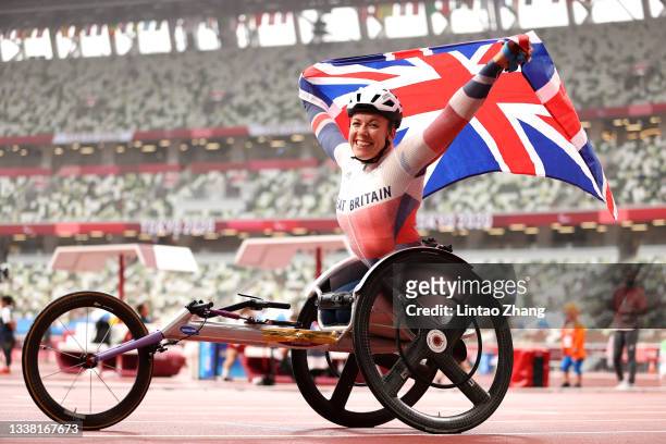 Hannah Cockroft of Team Great Britain celebrates winning the gold medal and breaking the paralympic record after competing in the Women's 800m - T34...