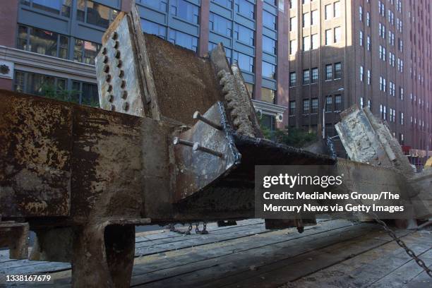 Steel beam from the wreckage of the World Trade Center is loaded on to a truck headed to Fresh Kills Landfill in Staten Island on September 19, 2001...
