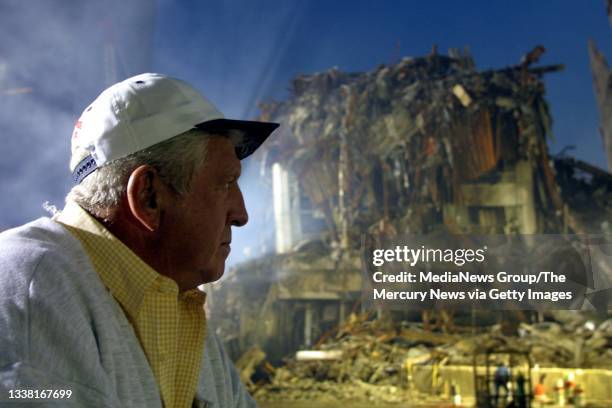 Crane operator Tom Walsh, photographed on September 23 helped to build the Twin Towers, and now he's helping with the clean-up.