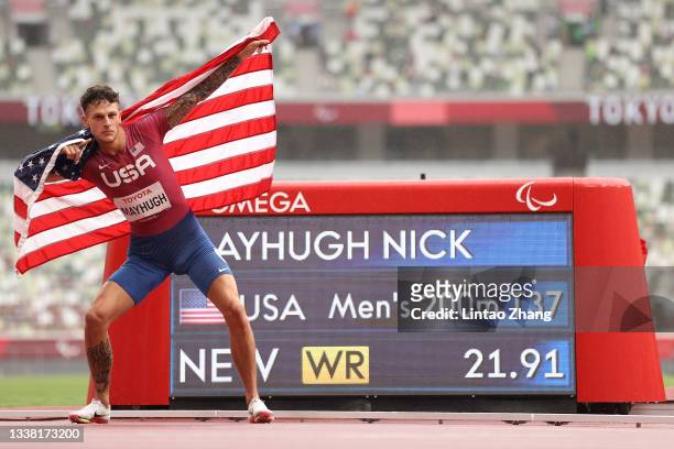 Nick Mayhugh of Team United States celebrates winning the gold medal and breaking the world record after competing in the Men's 200m - T37 Final on...