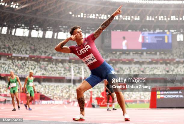 Nick Mayhugh of Team United States celebrates winning the gold medal and breaking the world record after competing in the Men's 200m - T37 Final on...