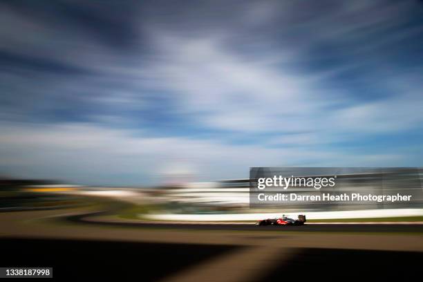 British McLaren Ferrari Formula One team racing driver Lewis Hamilton driving his MP4-27 racing car at speed through the 'S' curves during practice...