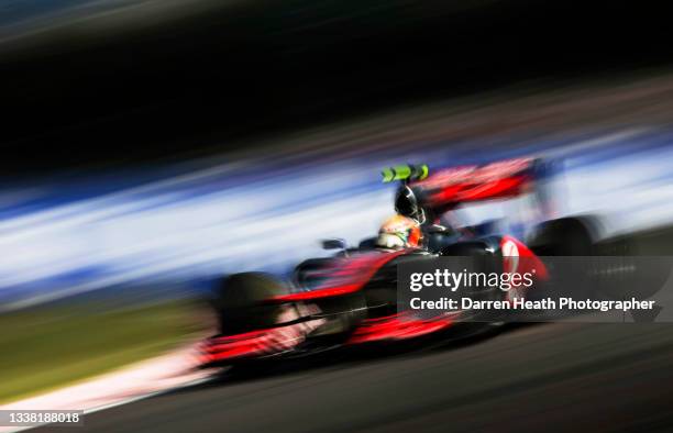 British McLaren Ferrari Formula One team racing driver Lewis Hamilton driving his MP4-27 racing car at speed through the 'S' curves during practice...