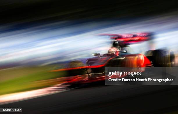 British McLaren Ferrari Formula One team racing driver Jenson Button driving his MP4-27 racing car at speed through the 'S' curves during practice...