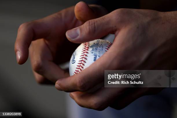 Anthony Santander of the Baltimore Orioles grips a ball in the dugout during a game against the New York Yankees at Yankee Stadium on September 3,...